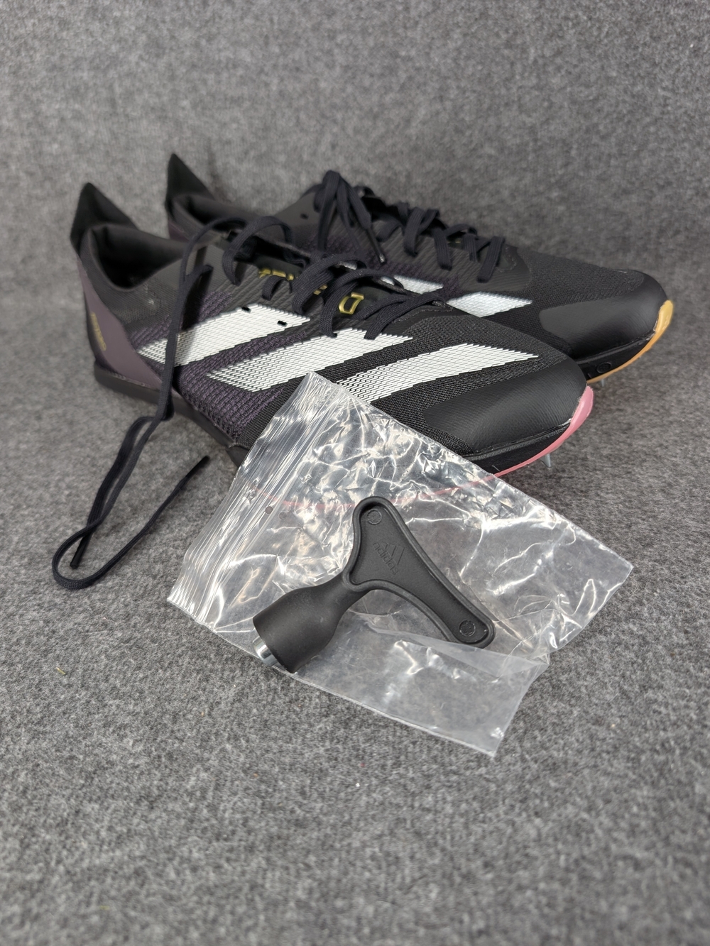 adidas Men’s Athletic Spikes – Black & White with Pink Accent